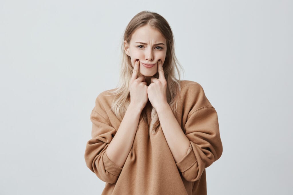 A young woman making a funny face